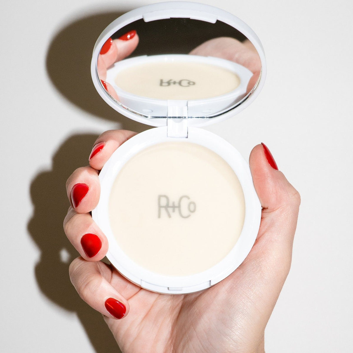Lifestyle image of R+Co Picture This Dry Texture Balm