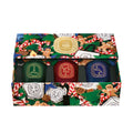 Lifestyle image of Diptyque Sapin, Friandise, and Étoile Set of 3 Small Holiday Candles (Limited Edition)