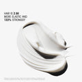 A smear of white Hair Alchemy Strengthening Mini Travel Set treatment cream for fragile hair, with text reading that hair is 2.9x more elastic and 133% stronger.
