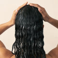 Model image of Christophe Robin Luscious Curl Conditioning Cleanser with Chia Seed Oil