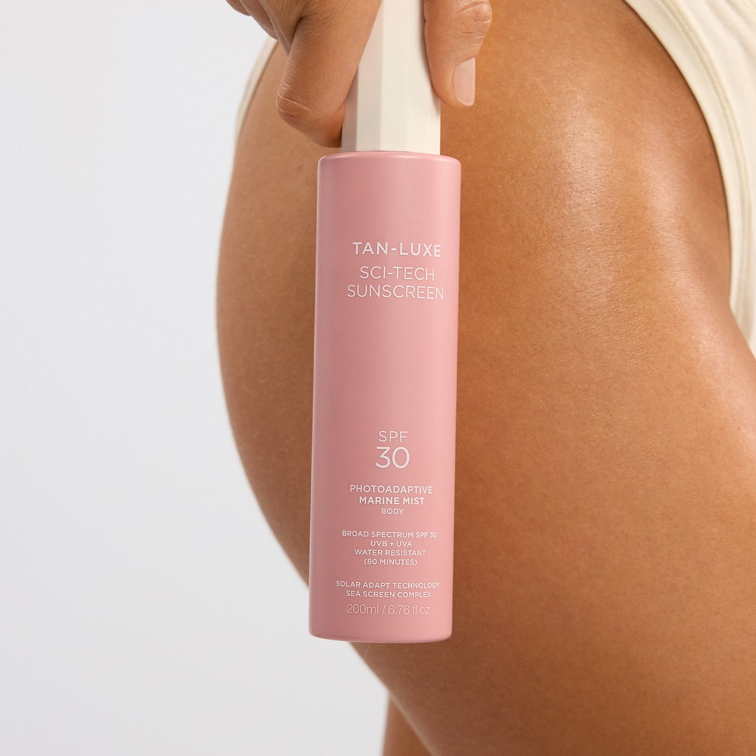 Model image of Tan-Luxe Sci-Tech Photoadaptive Marine Body Mist SPF 30
