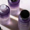 Lifestyle image of Nannette de Gaspé Essence Noir Bi-Phasic Eye Makeup Remover