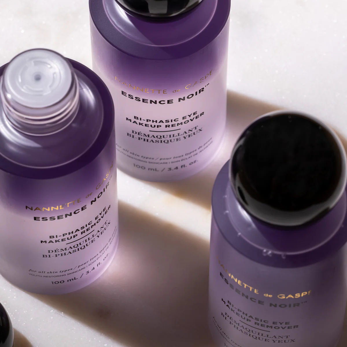 Lifestyle image of Nannette de Gaspé Essence Noir Bi-Phasic Eye Makeup Remover