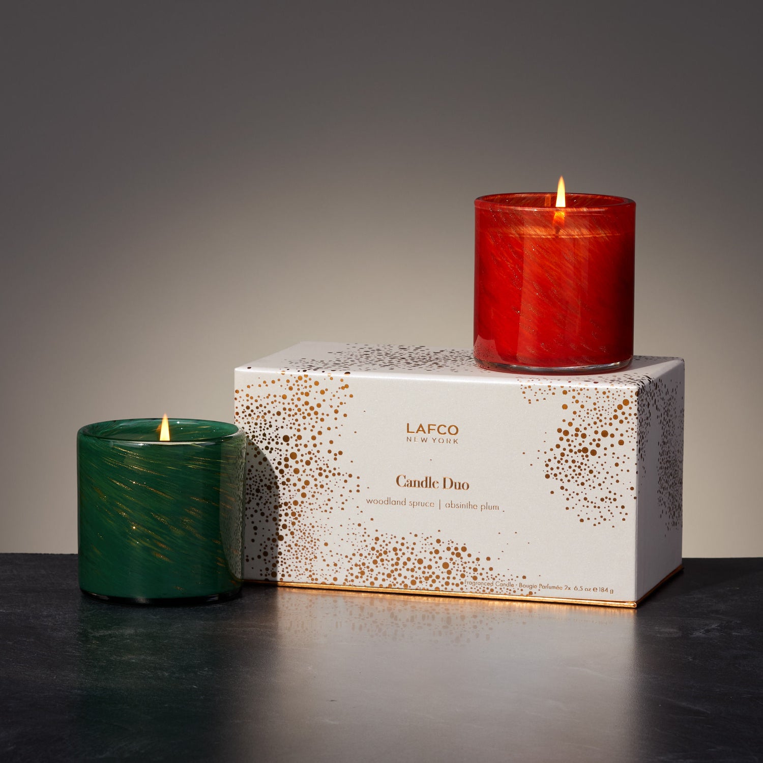 Lifestyle image of Lafco Absinthe Plum and Woodland Spruce Candle Duo (Limited Edition)