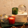 Lifestyle image of Lafco Absinthe Plum and Woodland Spruce Candle Duo (Limited Edition)