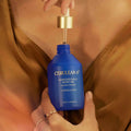 Cerulean 6 Honeyed Halo Body Oil in Constellation lifestyle image .