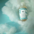 Lifestyle image of R+Co On A Cloud Baobab Oil Repair Shampoo