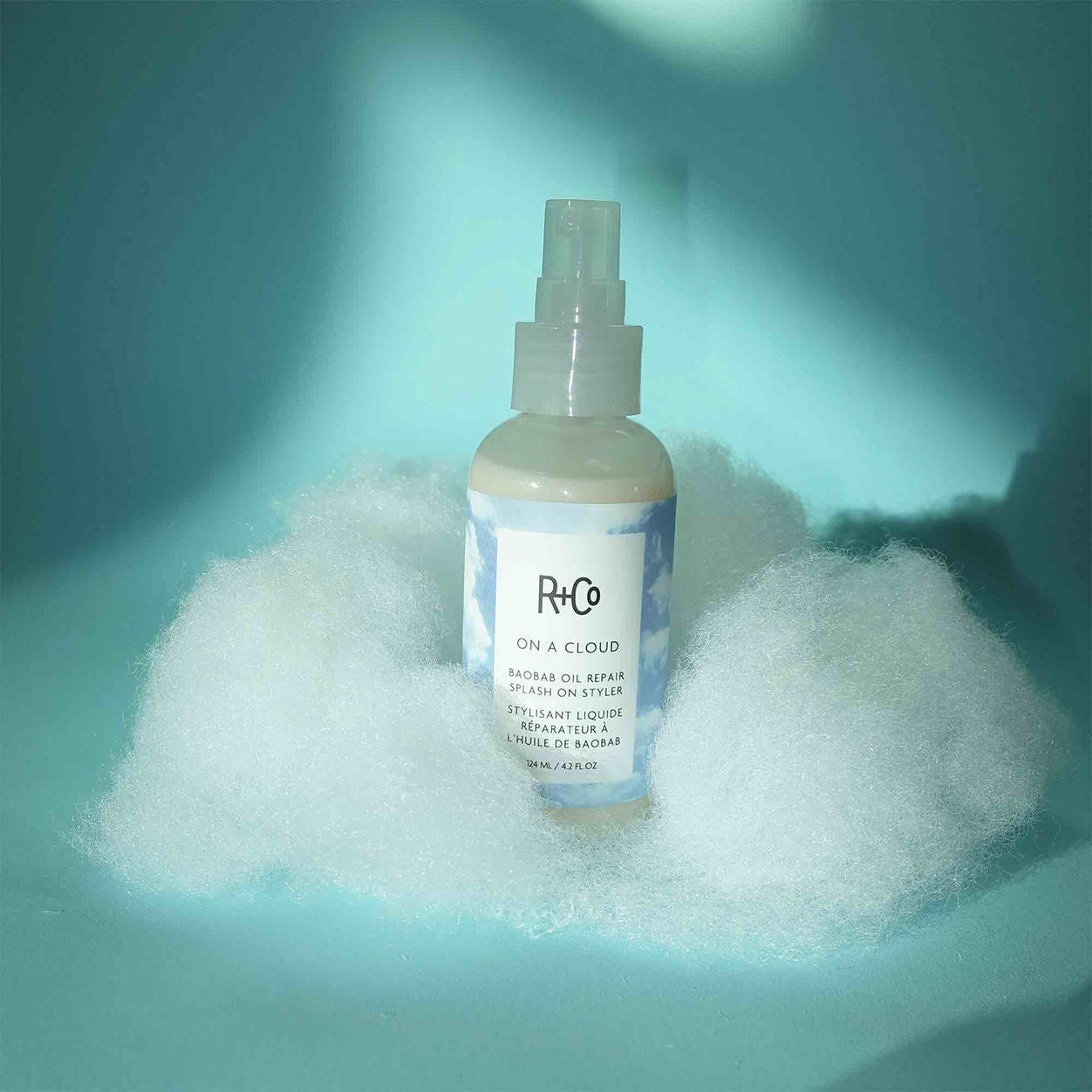 Lifestyle image of R+Co On A Cloud Baobab Oil Repair Splash on Styler