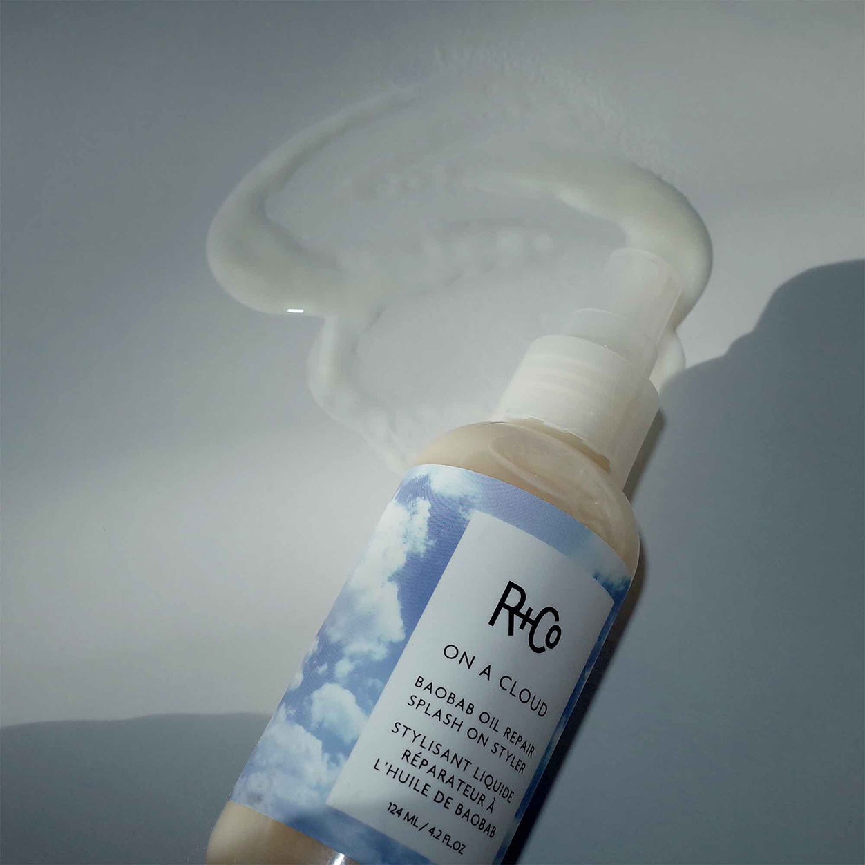 Lifestyle image of R+Co On A Cloud Baobab Oil Repair Splash on Styler