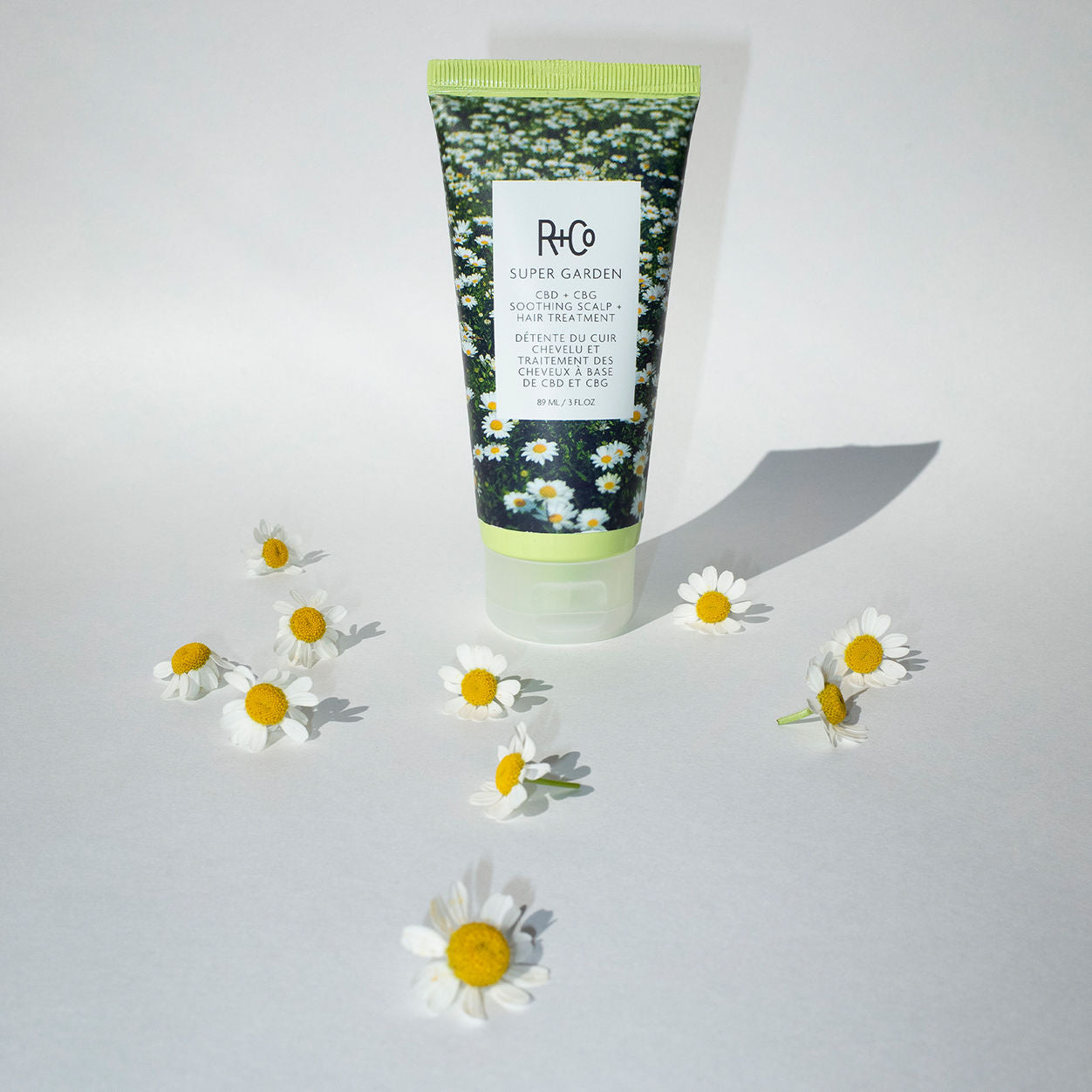 Lifestyle image of R+Co Super Garden CBD and CBG Scalp Treatment