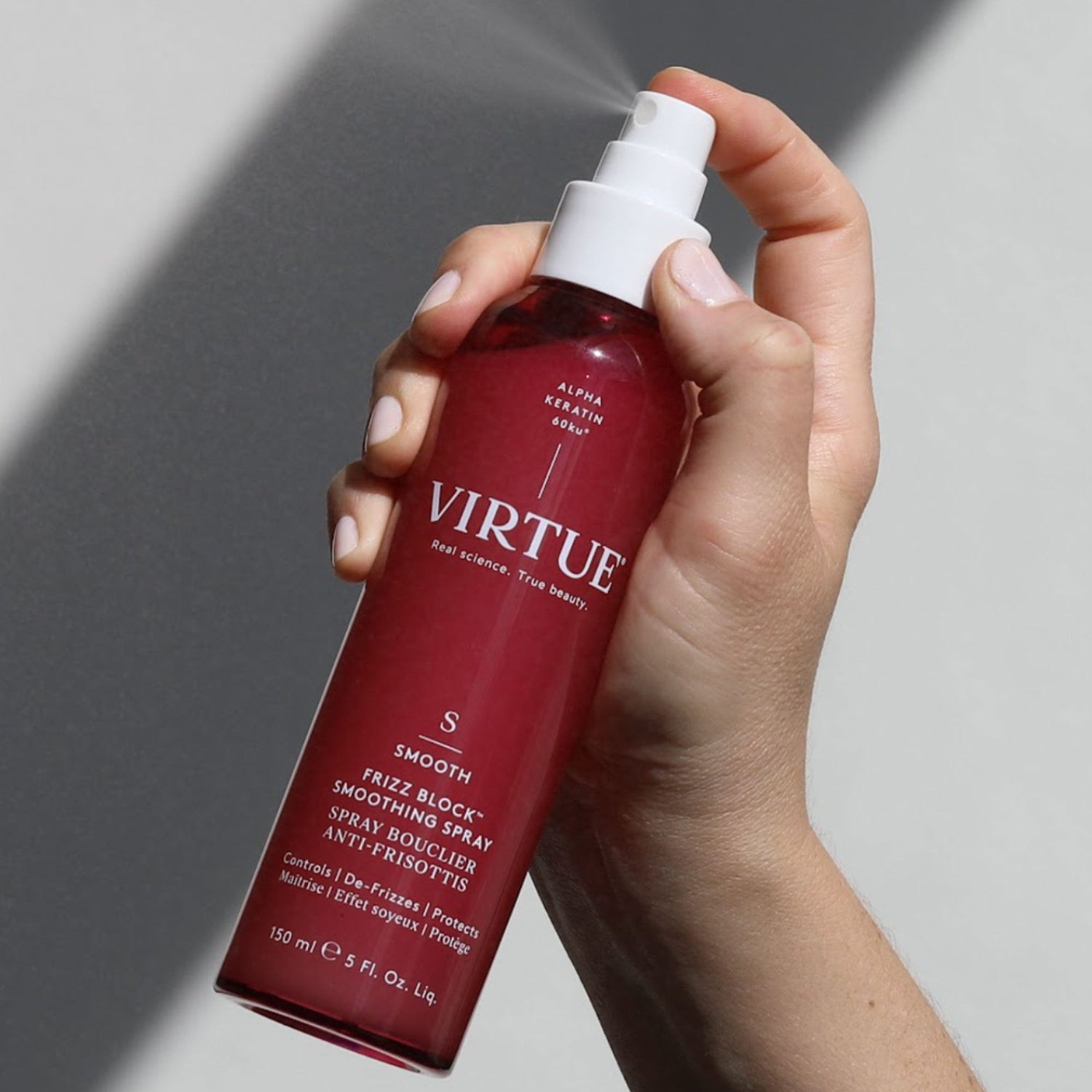 Lifestyle image of Virtue Frizz Block Smoothing Spray