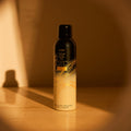 Lifestyle image of Oribe Gold Lust Dry Heat Protection Spray