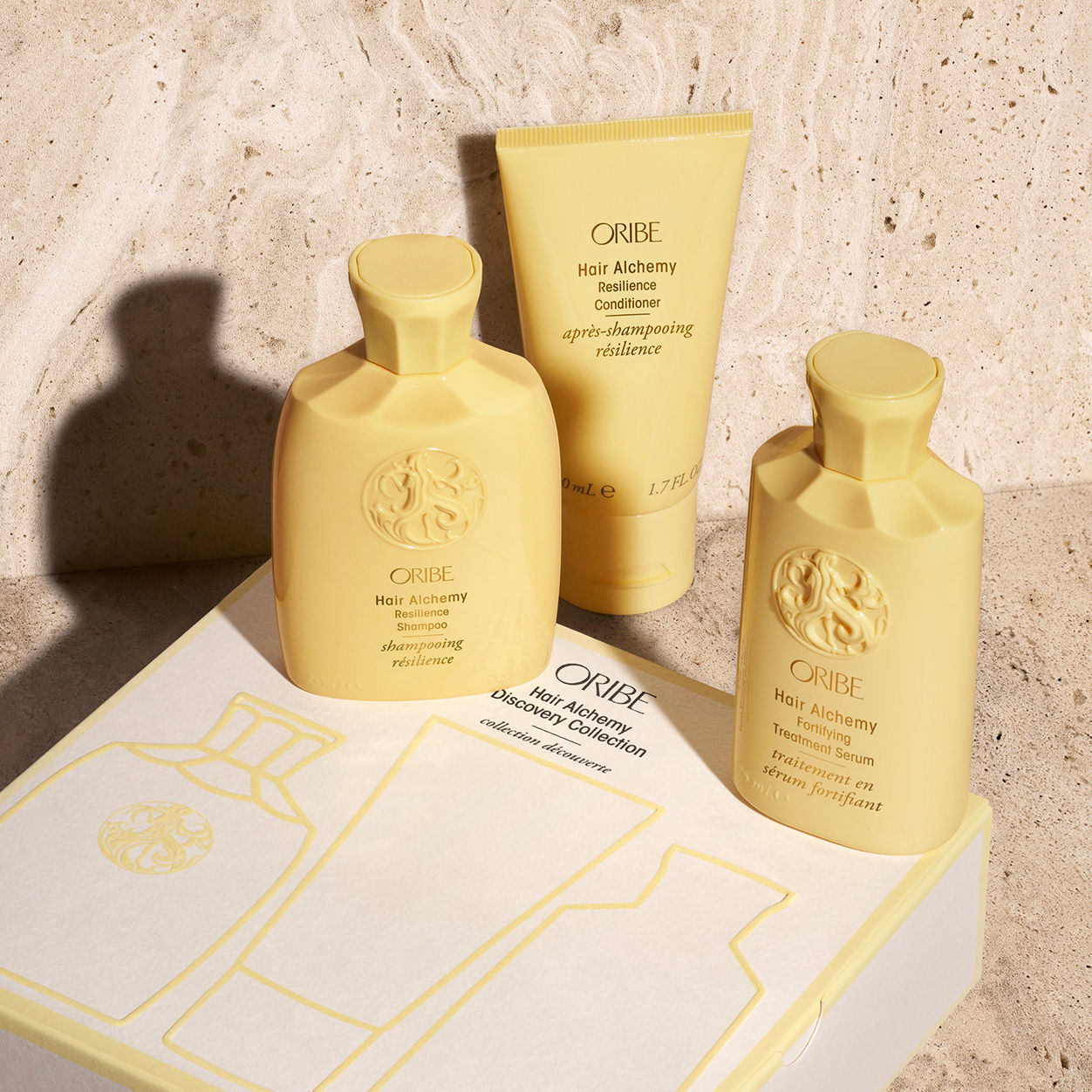 Lifestyle image of Oribe Hair Alchemy Discovery Collection Travel Set