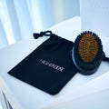 Lifestyle image of HigherDose Supercharge Copper Body Brush