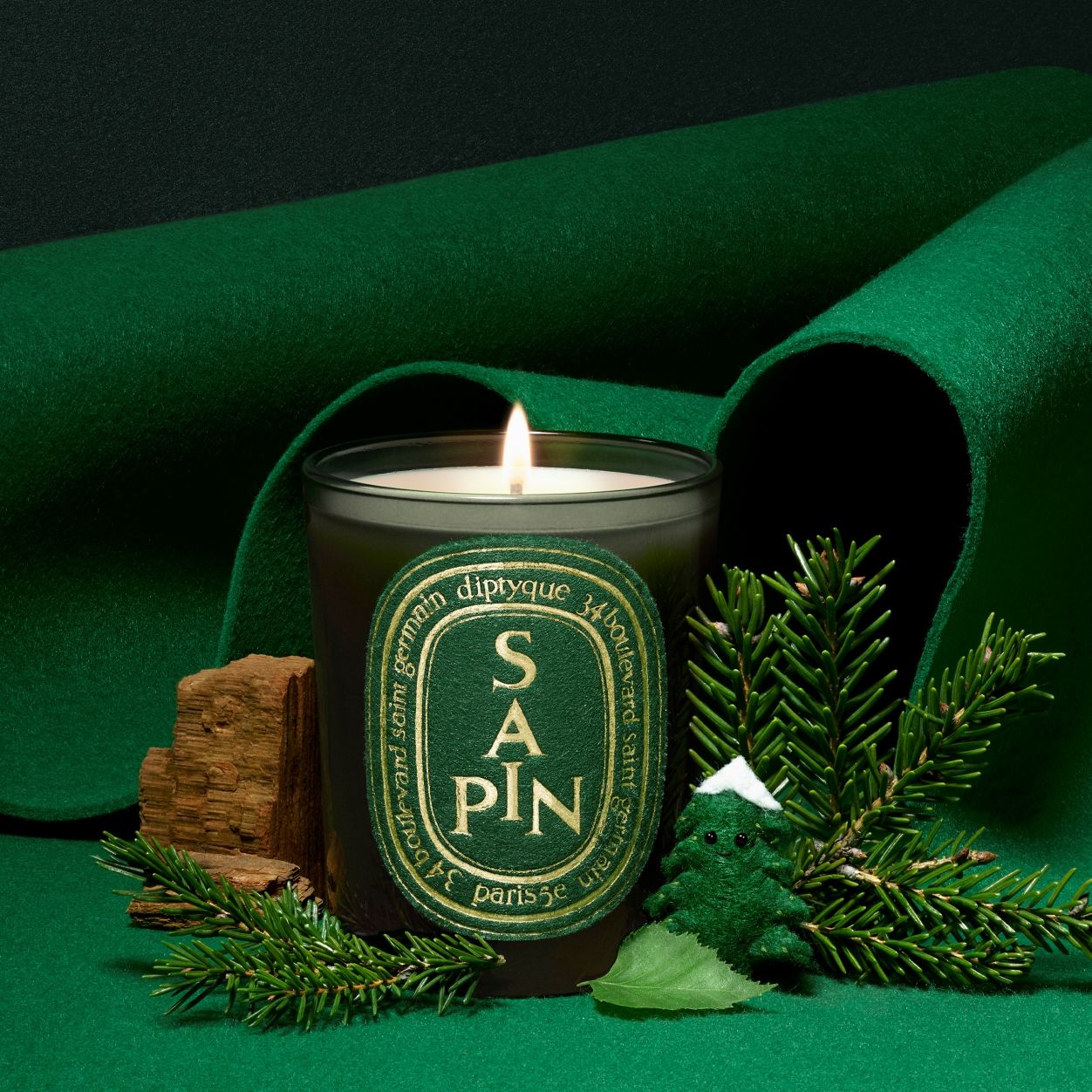 Lifestyle image of Diptyque Sapin Candle (Limited Edition)