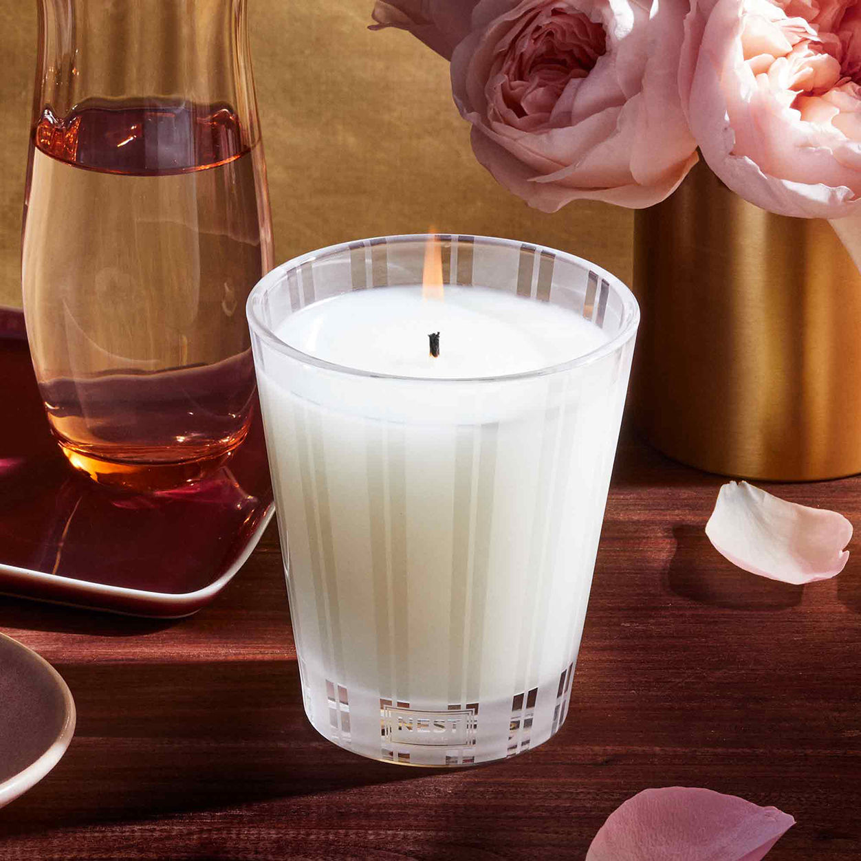 Lifestyle image of Nest Rose Noir and Oud Candle variant: 8.1 oz (Classic)