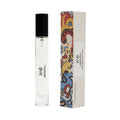 A thin glass roll-on Tudor Eau De Parfum bottle next to its tall, rectangular box featuring a merchant print tapestry design and gold lettering.