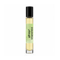 A tall, cylindrical D.S. & Durga Pistachio Eau de Parfum rollerball bottle containing amber-colored liquid with a light green label.