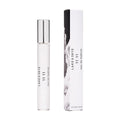 A white Lake & Skye 11 11 Eau de Parfum rollerball bottle and its matching white box decorated with an amber-toned black and white image of clouds.