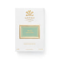 White rectangular box for Wild Vetiver Eau de Parfum by Creed, featuring a gold crest, a sage green label with the fragrance name, and details indicating a 50 ml, 1.7 fl. oz. volume.