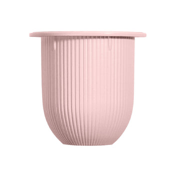 A pale pink, ribbed cylindrical jar of Neuraé Joie The Emulsion radiance cream with a wide, flat rim.