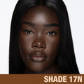 Model image of Charlotte Tilbury  Charlotte's Beautiful Skin Foundation variant: 17 Neutral (deepest with neutral undertones)