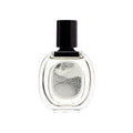 Clear glass Diptyque L’Eau Papier Eau de Toilette bottle with a black cylindrical cap and a label featuring a black-and-white abstract ink drawing for a fresh fragrance.