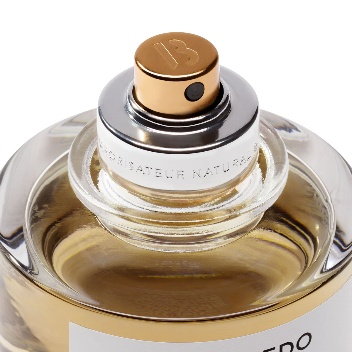 Close-up of a Gypsy Water Absolu de Parfum bottle sprayer with a gold cap.