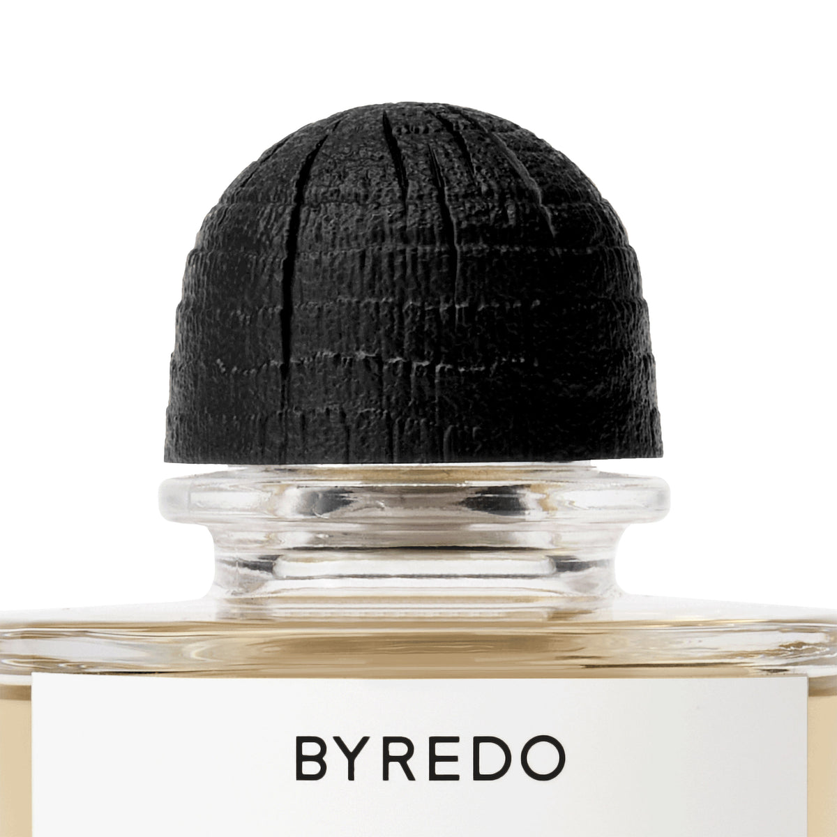 A glass bottle of Gypsy Water Absolu de Parfum with a textured black cap and a white label featuring the Byredo brand name in black text.