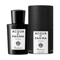 Black Colonia Essenza Eau de Cologne bottle and its cylindrical case, both featuring white labels with black text and a modern classic fragrance crest.