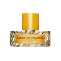 A rectangular Faces of Francis Eau de Parfum bottle with a textured edge and gold cylindrical cap, featuring a gold label for the Vilhelm Parfumerie scent with notes of vetiver and saffron.