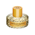 A round, faceted glass bottle of Faces of Francis Eau de Parfum by Vilhelm Parfumerie, featuring a yellow cylindrical cap and notes of vetiver and saffron.