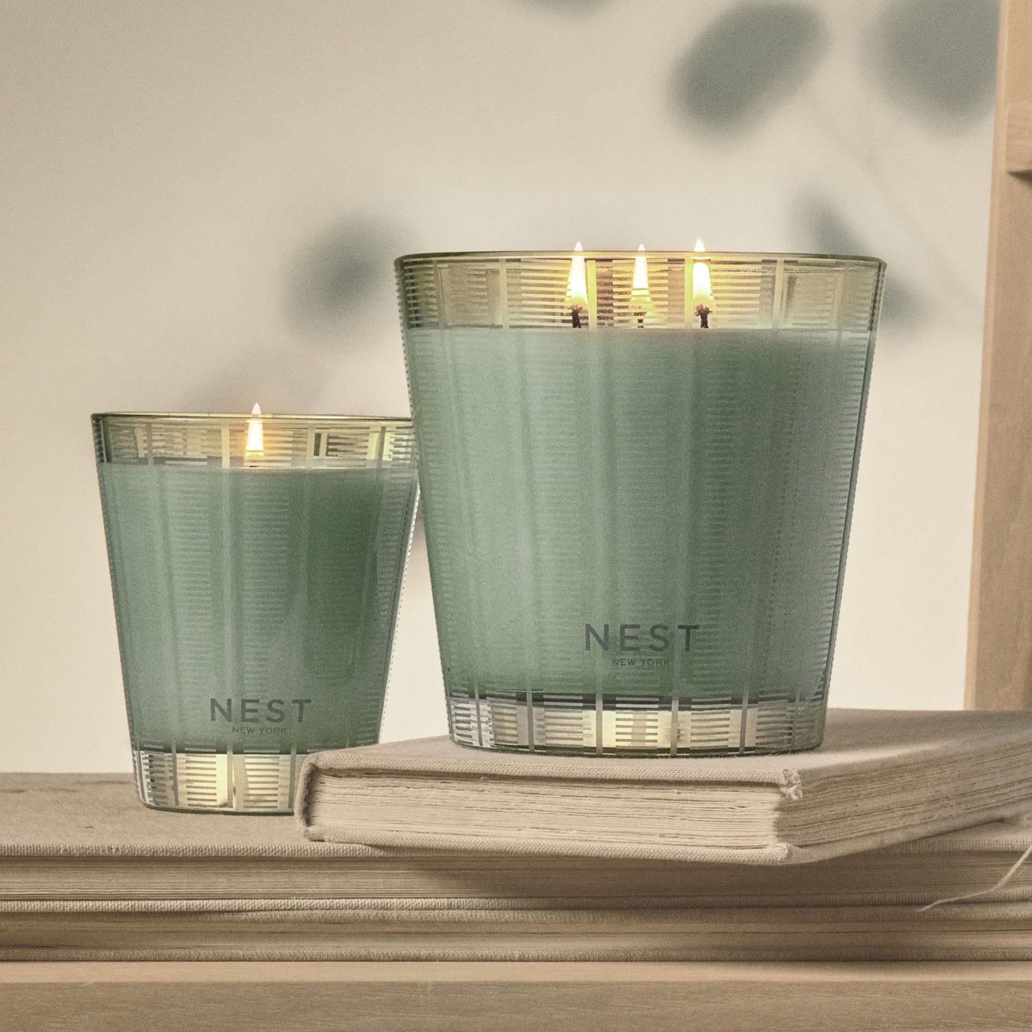 Lifestyle image of Nest Wild Mint & Eucalyptus Candle variant: 21.1 oz (3-Wick)