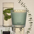 Lifestyle image of Nest Wild Mint & Eucalyptus Candle variant: 21.1 oz (3-Wick)