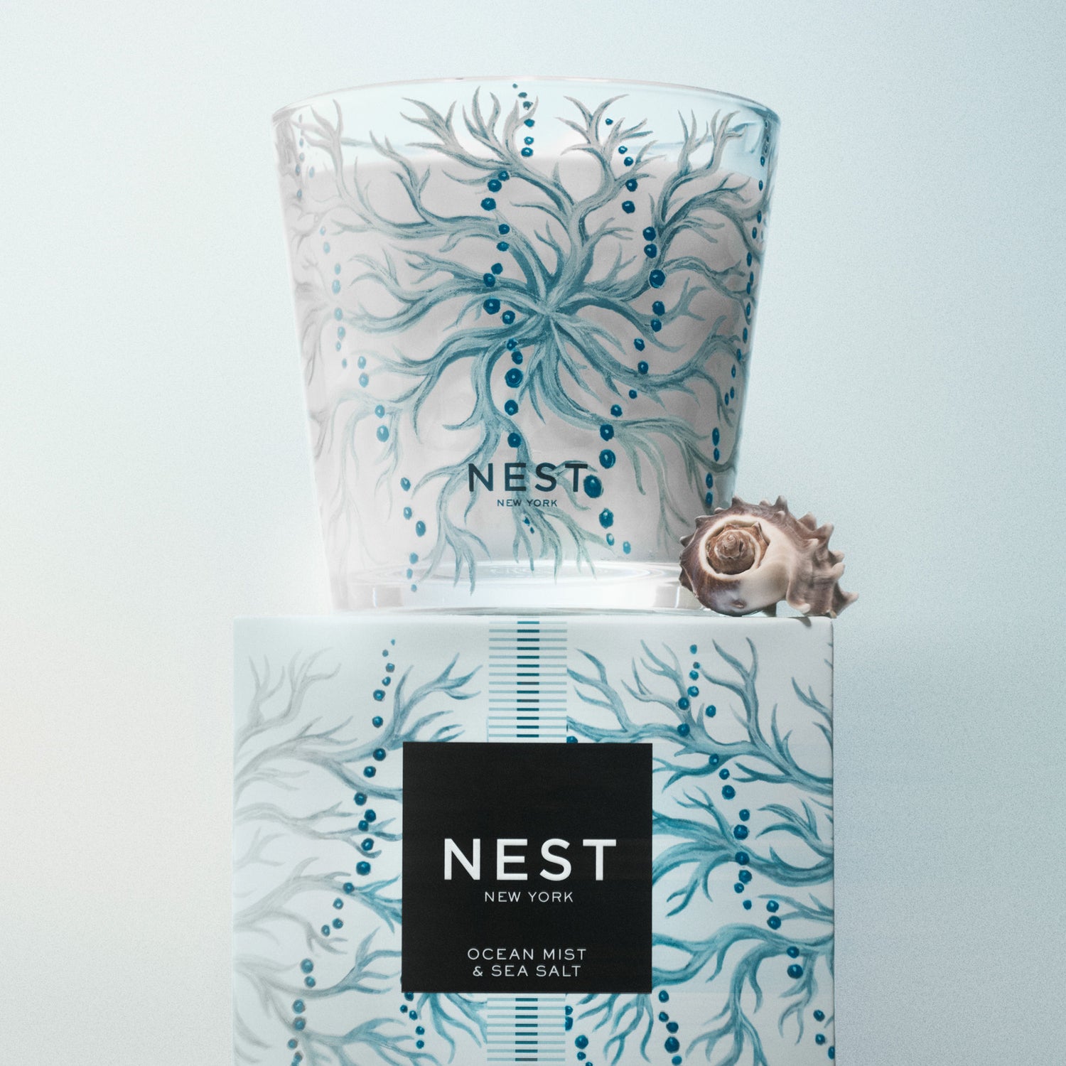 Lifestyle image of Nest Ocean Mist & Sea Salt Decorative Luxury Candle variant: 21.2 oz (3-Wick)