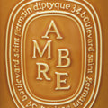 Image of an open Diptyque Ambre (Amber) Candle variant: 21.2 oz (Large)