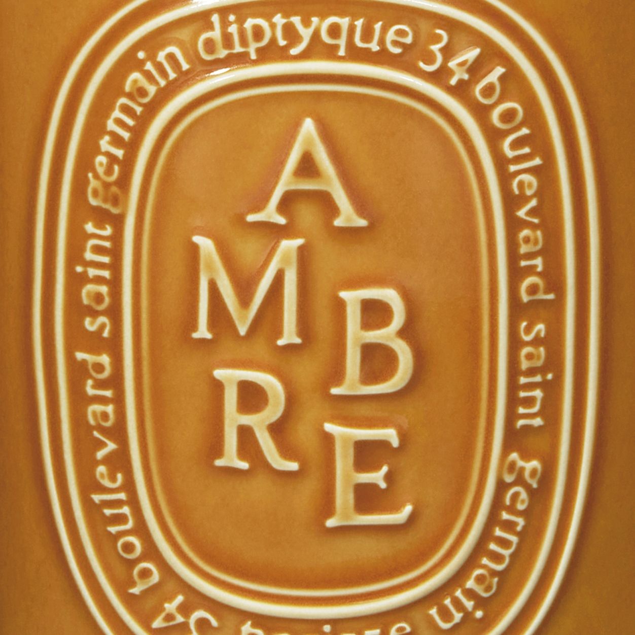 Image of an open Diptyque Ambre (Amber) Candle variant: 21.2 oz (Large)