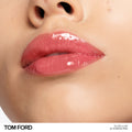 Model image of Tom Ford Gloss Luxe Lip with Hydrating Jojoba Oil variant: 22 SUNRISE PINK