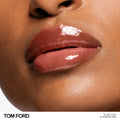 Model image of Tom Ford Gloss Luxe Lip with Hydrating Jojoba Oil variant: 22 SUNRISE PINK