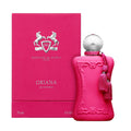 Bright pink Oriana Eau de Parfum bottle with a silver cap and pink tassels, standing next to its matching pink rectangular box.
