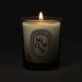 Lifestyle image of Diptyque Mimosa Candle variant: 2.5 oz (Small)