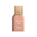 A bottle of Phyto-Teint Nude Foundation with a gold cap and light peach liquid for a natural radiant complexion.