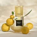 Lifestyle image of Nest Sunlit Yuzu & Neroli Candle variant: 2 oz (Votive)