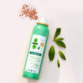 Lifestyle image of Klorane Dry Shampoo With Nettle for Dark Hair variant: 3.2 oz