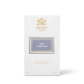 Creed Iris Debonair Eau de Parfum box featuring a gold crest and the text Iris Debonair on a light purple label.