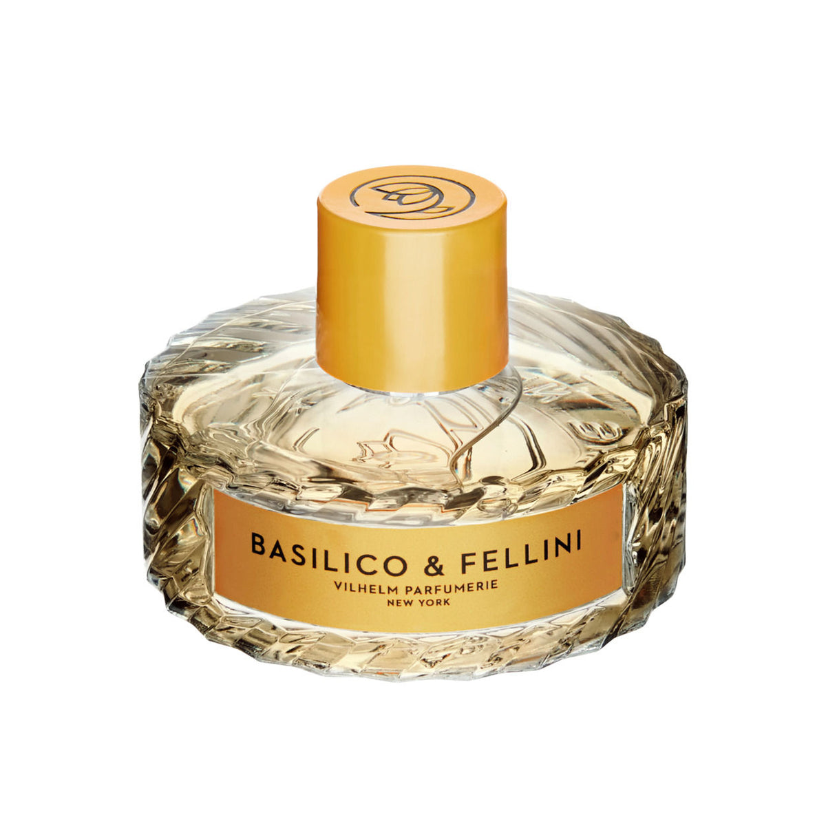 A round, faceted glass bottle of Vilhelm Parfumerie Basilico and Fellini Eau de Parfum with a golden yellow cap and a matching label.