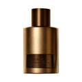 Cylindrical metallic brown Tom Ford Oud Minerale Eau de Parfum bottle with a matching cap, evoking a sense of mystery.