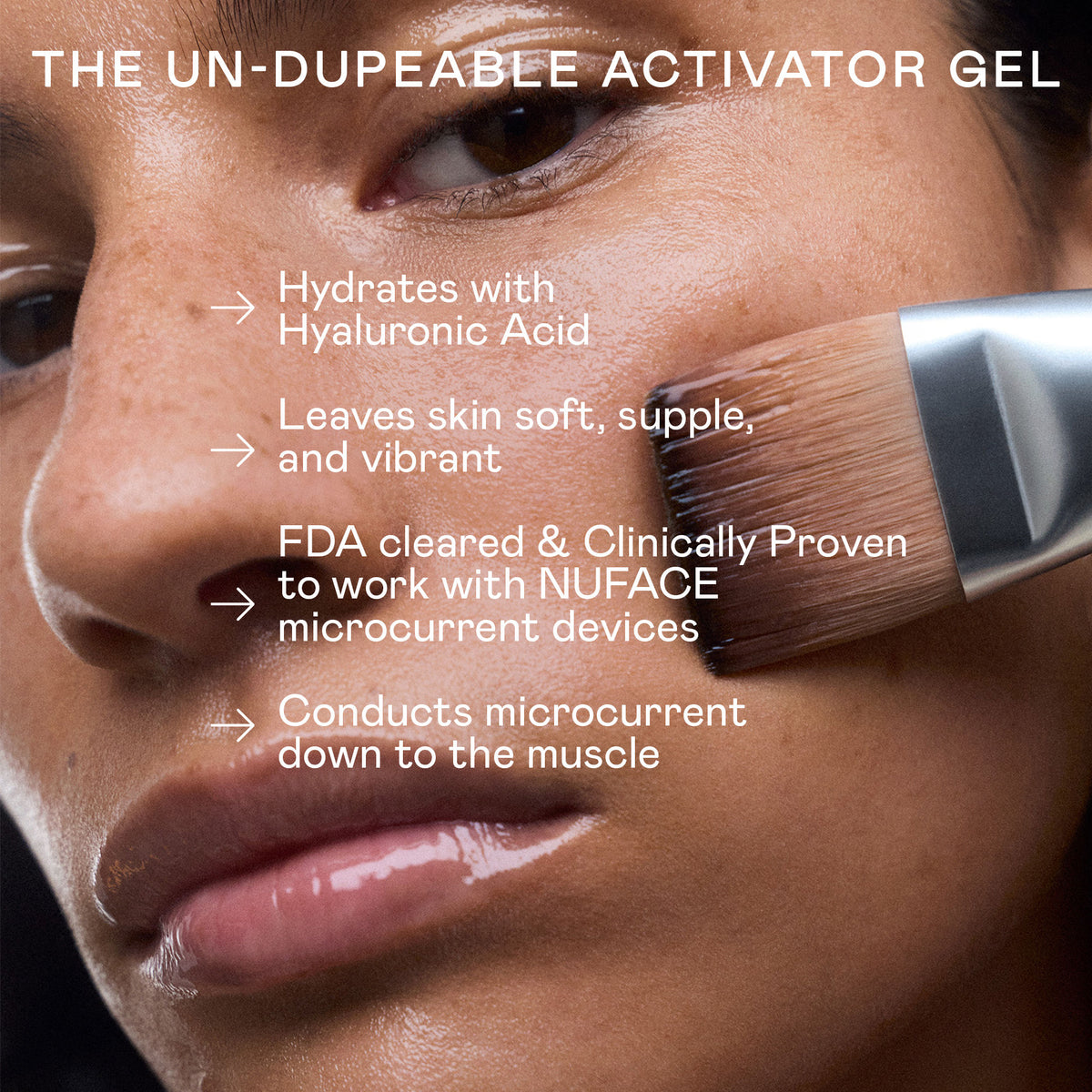 A flat brush applies NuFace Aqua Gel Hydrating Microcurrent Activator with Hyaluronic Acid to a cheek, hydrating the skin to leave it soft and vibrant.