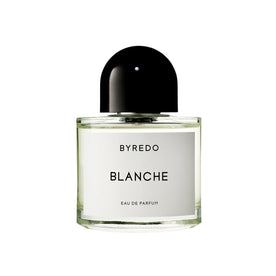 A clear glass bottle of Byredo Blanche Eau de Parfum with a rounded black cap and a white label, featuring notes of rose and sandalwood.