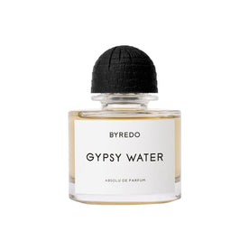 A glass Byredo Gypsy Water Absolu de Parfum bottle with a black textured cap.
